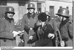 Ordnungspolizei conducting a raid (razzia) in Cracow's Jewish Ghetto, January 1941.